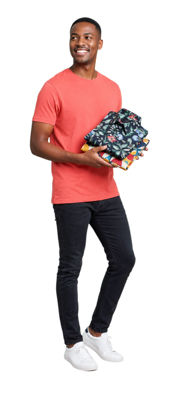 Cape Town creative wearing a coral T-shirt and carrying printed shirt samples